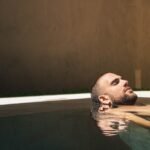 man floating on water